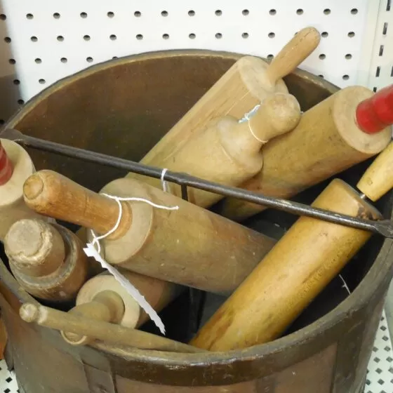 Bucket of assorted rolling pin styles