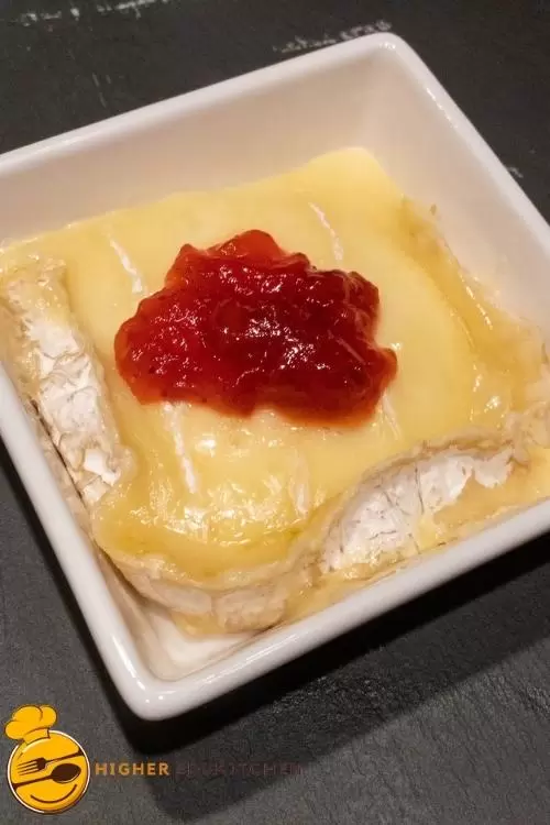 Brie layered with strawberry jam