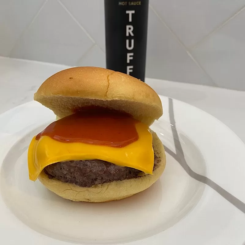 TRUFF Hot Sauce on a Burger